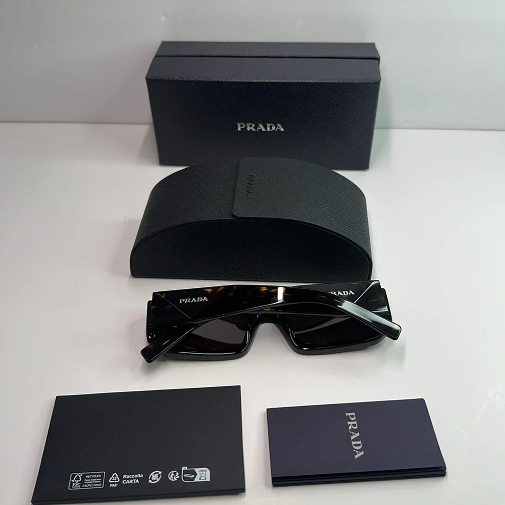 Prada PR06YS Brown Sunglasses with Bold Frames and UV Protection